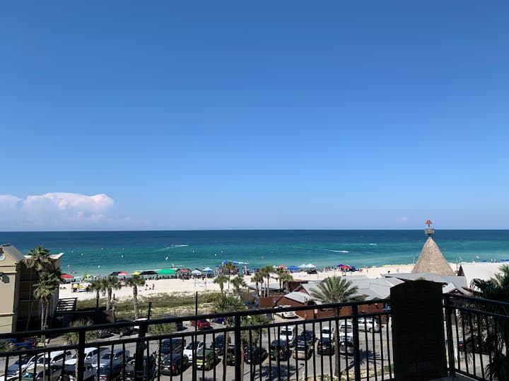 Gulf of Mexico and white-sand beach seen from a beachfront condo balcony in Panama City Beach