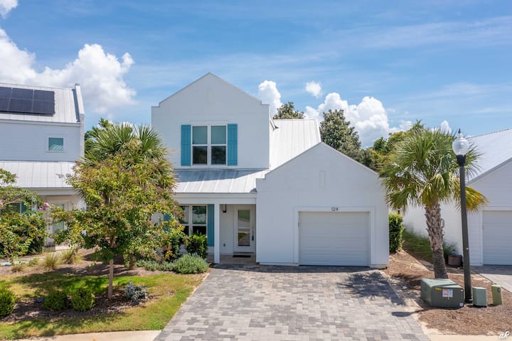 Villa Blue, a white 3-bedroom beach house with blue shutters near Pier Park